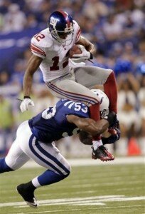 Kavell Conner tackles Steve Smith in an early season meeting with the Giants at home in 2010. (AJ Mast | AP Photo)