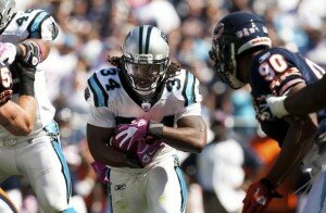 Carolina Panthers running back DeAngelo Williams runs with the ball against the Chicago Bears during an NFL football game in Charlotte